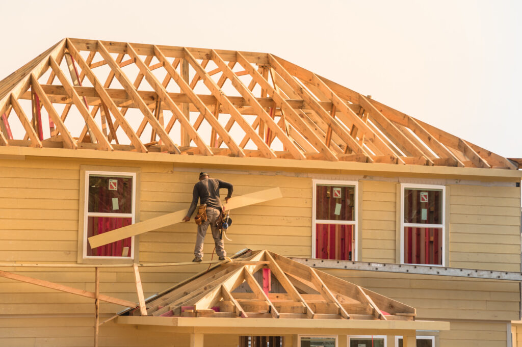 image of a man framing a new building